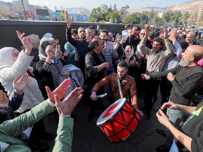 People in Damascus celebrate on December 9, 2024. Picture: by Bakr ALKASEM / AFP