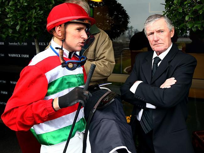  Nathan Berry, who had just won on Il Mio Destino during a midweek race meeting at Warwick Farm, talks to his father Kevin who is the trainer of the horse. 