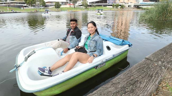 DRAWCARD: Tourists Mark and Sujana Gurung on the River Torrens yesterday. Picture: Tait Schmaal