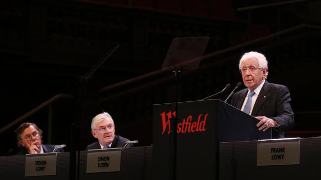 Peter Lowy (left) and Steven Lowy watch as Sir Frank Lowy addresses shareholders at today’s meeting. (Hollie Adams/The Australian)