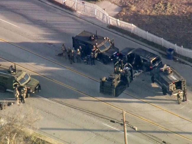 Final shootout ... a bullet-riddled SUV with the attackers responsible for the mass shooting. Picture: AFP