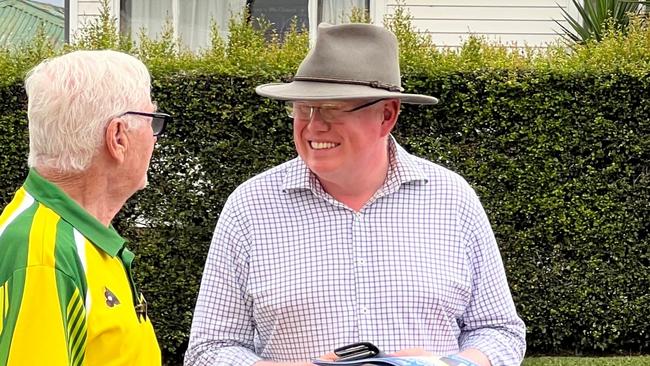 Kiama MP Gareth Ward talking to a voter at Bomaderry Public School on election day. Picture: Dylan Arvela