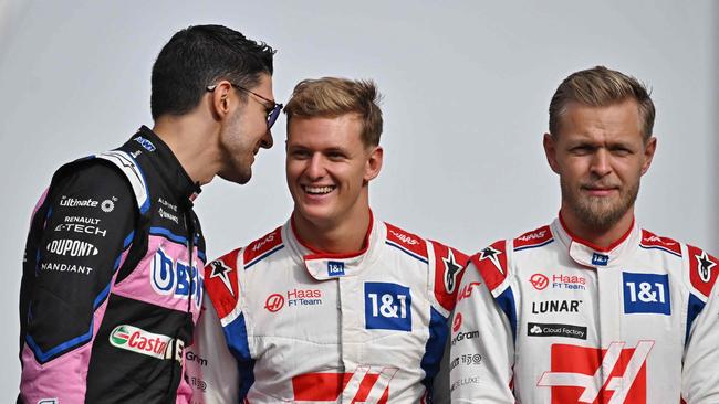 Schumacher (centre) had two years with the Haas F1 team. (Photo by Ben Stansall / AFP)