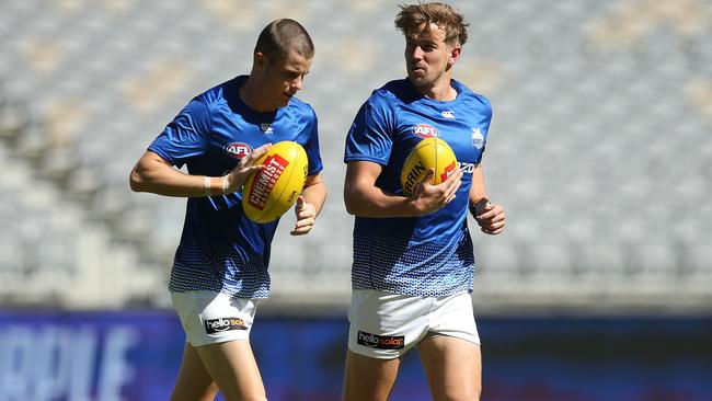 Bailey Scott with teamamte Trent Dumont ahead of his Round 1 debut against the Dockers.