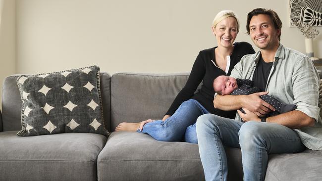 Dentists Ellie Hotinski and Andrew South with their four-week-old baby August, at home. Picture: Matt Loxton