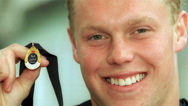 Sam Mitchell with his JJ Liston Trophy medal in 2002.