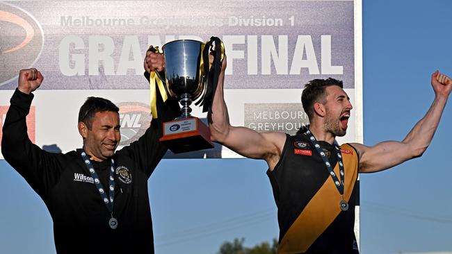 Vinny Dattoli and Sam Gilmore lift the NFNL Division 1 premiership cup in 2023. Picture: Andy Brownbill