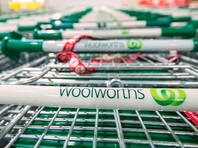 The logo of Woolworths Ltd.'s Woolworths chain of supermarkets is displayed on shopping trolleys in Sydney, Australia, on Tuesday, Aug. 27, 2013. Woolworths Ltd., Australia's largest retailer, is scheduled to report full-year results on Aug. 28. Photographer: Ian Waldie/Bloomberg