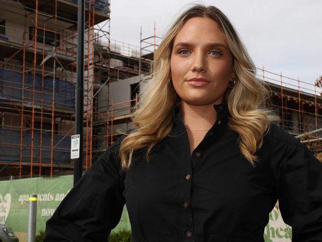 ADELAIDE, AUSTRALIA - Advertiser Photos JANUARY 20, 2023: Holly Russell in front of the off-the-plan apartment at Norwood Green development she invested in and qualified for the HomeBuilder grant but because of delays in building the money may not be available because the development won't be finished in time. Picture Emma Brasier