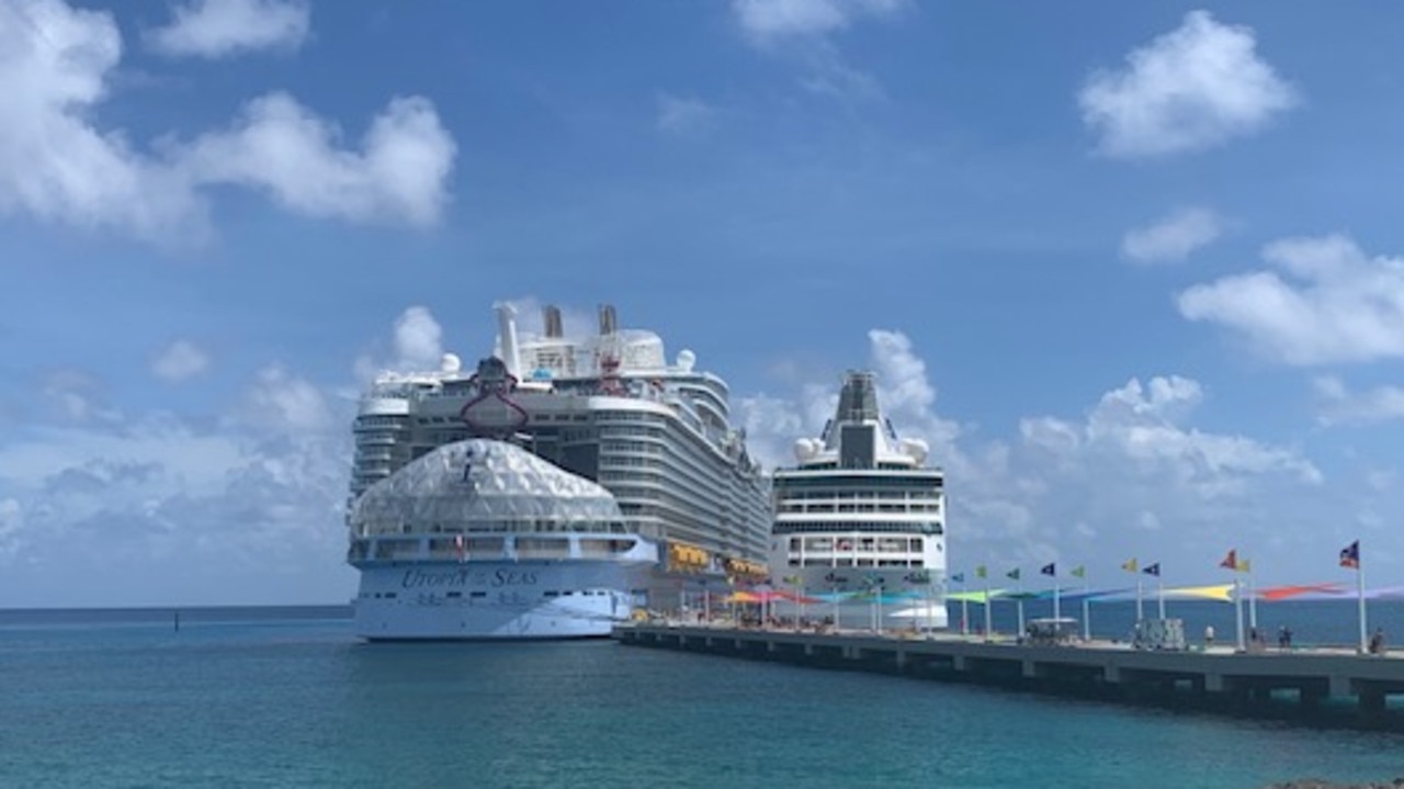 Utopia of the Seas, on the left, parked in the Bahamas. Picture: Supplied