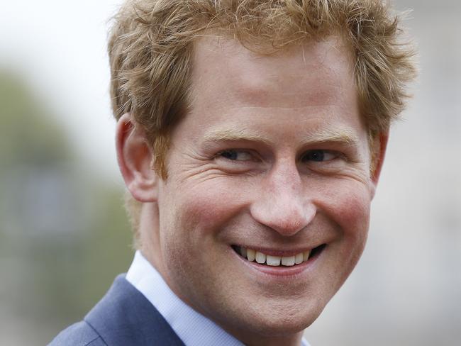 Britain's Prince Harry smiles as he attends the presentation ceremony at the 35th London Marathon, Sunday, April 26, 2015. (AP Photo/Kirsty Wigglesworth)