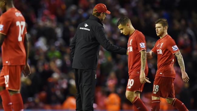 Liverpool's German manager Jurgen Klopp (C) greets his players after losing the English Premier League football match between Liverpool and Crystal Palace at the Anfield stadium in Liverpool, north-west England on November 8, 2015. AFP PHOTO / PAUL ELLIS RESTRICTED TO EDITORIAL USE. No use with unauthorized audio, video, data, fixture lists, club/league logos or 'live' services. Online in-match use limited to 75 images, no video emulation. No use in betting, games or single club/league/player publications.