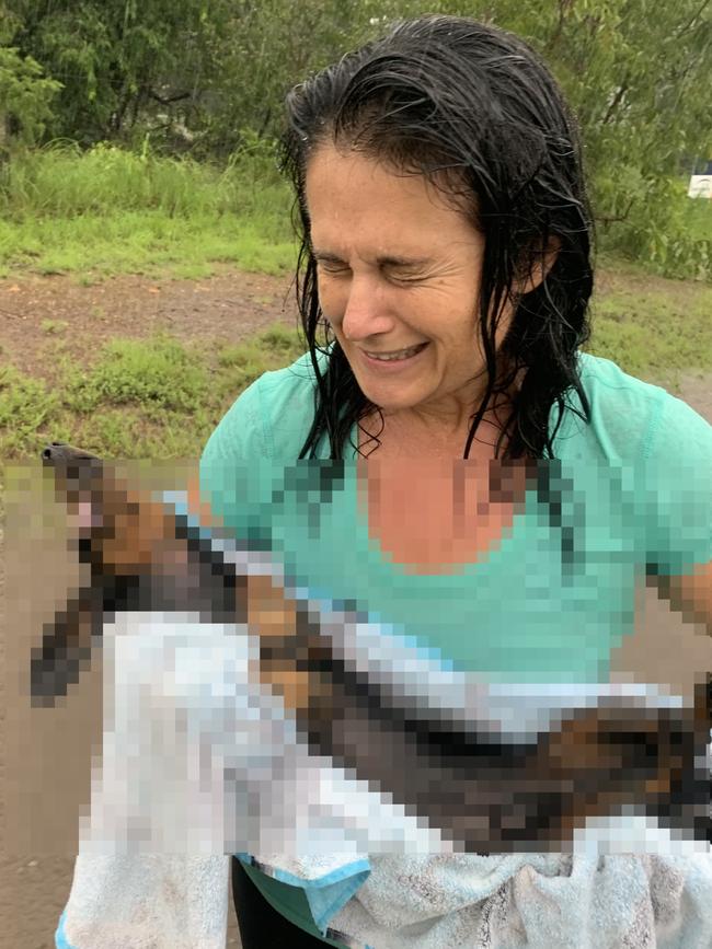 A distraught Yvette Goldberg with the body of her pet dachshund Pancake after the attack. Picture: Yvette Goldberg