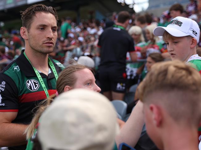 GOSFORD, AUSTRALIA - FEBRUARY 15: Cameron Murray of the Rabbitohs signs autographs for fans during the 2025 NRL Pre-Season Challenge match between South Sydney Rabbitohs and Manly Sea Eagles at Industree Group Stadium on February 15, 2025 in Gosford, Australia. (Photo by Scott Gardiner/Getty Images)