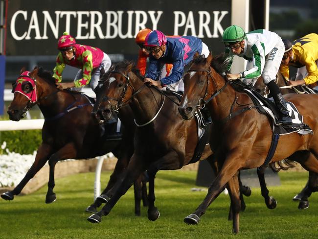 Jockey Andrew Adkins (green hat) rides Duchess Pedrille to win race 4, Book Summer Hospitality Today Sprint, during Canterbury Park Summer Night Racing in Sydney, Friday, December 15, 2017. (AAP Image/Daniel Munoz) NO ARCHIVING, EDITORIAL USE ONLY