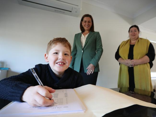 Oscar Higgins 8 with mother Melanie , Oscar has Dyslexia. Deb Frecklington with Oscar at home in Carina Pic Jamie Hanson