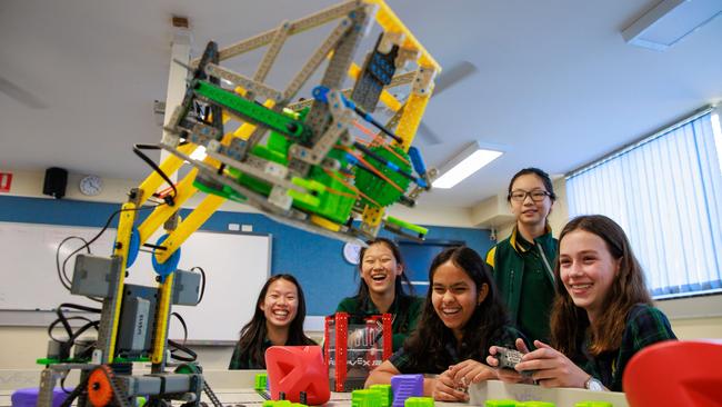 12-year-old robotics enthusiasts Grace Lin, Jocelyn Feng, Ezzah Ali, Jiayu Hu and Annika Jacobson have built and programmed this contraption for an international competition. Picture: Justin Lloyd.