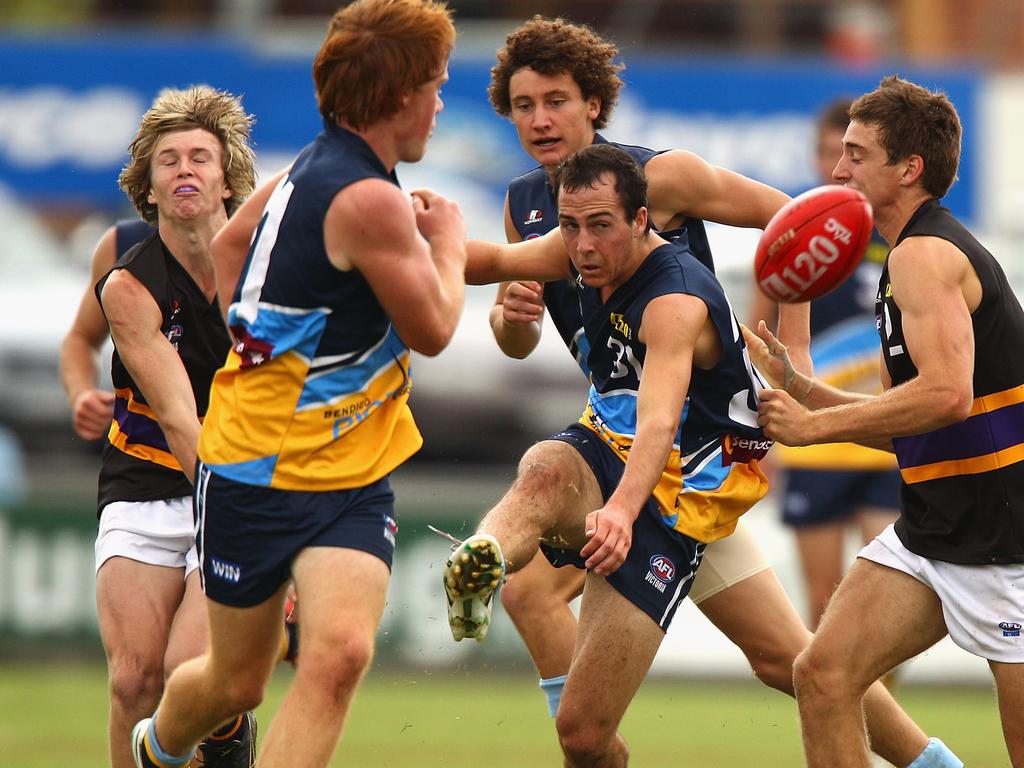 BENDIGO, AUSTRALIA - APRIL 10: Martin Kelly of the Pioneers kicks out of the pack during the round three TAC Cup match between the Bendigo Pioneers and the Murray Bushrangers at Queen Elizabeth Oval on April 10, 2010 in Bendigo, Australia. (Photo by Ryan Pierse/Getty Images)