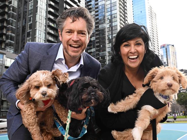 Nick Reece with his dogs Banjo and Ziggy and Roshena Campbell with her dog Peanut promise to make pet registrations free if elected. Picture: Josie Hayden