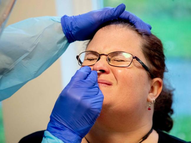 A nurse takes a nasal sample of a nursing aide for a rapid Covid-19 test before she can start her shift at a nursing home for elderly in Lerum, Sweden. Picture: AFP