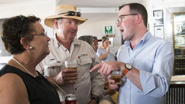 Agriculture Minister Adam Marshall speaks with locals Tony and Sally Quigley yesterday at the Nevertire Hotel during the State Cabinet visit to Bourke. Picture: Dylan Robinson