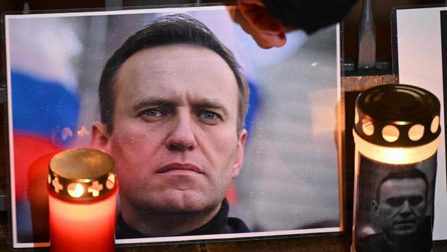 Candles and a photo of Russian opposition leader Alexei Navalny are left at a makeshift memorial in Frankfurt, western Germany. Picture: AFP