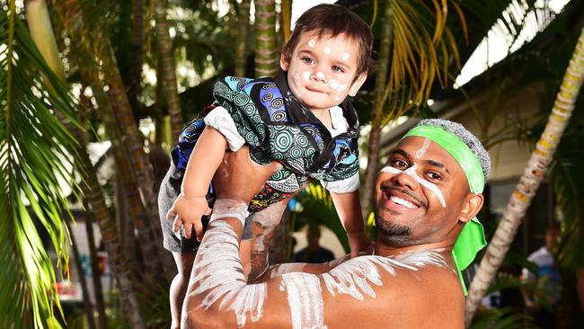 Sarbi Baker from the Wulgurukaba Walkabout dance group with his nephew Kywame Pedro, 11 mths, celebrate NAIDOC week. Picture: Shae Beplate.