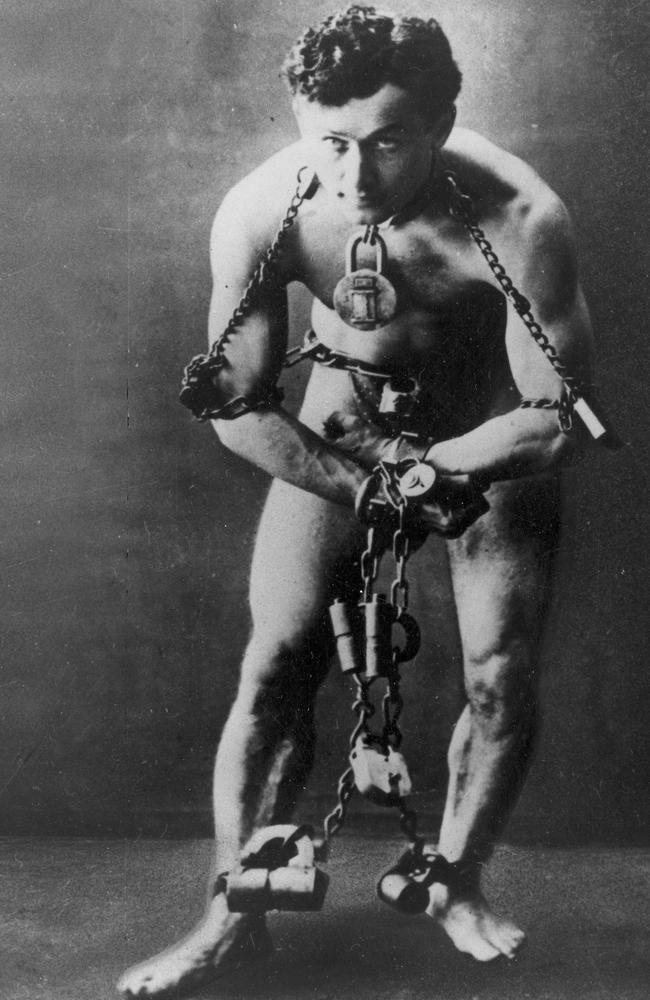 Rock star of magicians ... Legendary escape artist Harry Houdini is shown in chains in this photo circa 1899. Picture: AP Photo