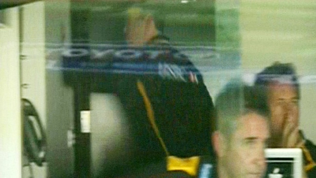 Alastair Clarkson puts his hand through the wall of the MCG coaches’ box.