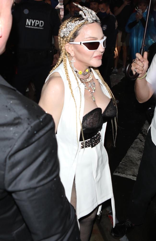 The Queen of Pop was surrounded by security as she arrived at the premiere. Picture: Madonna BACKGRID