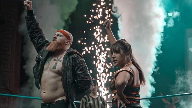 Teulan (left) nearly ran into the back of a police car. Pictured here as wrestler Jack J Bonza. . Picture: Facebook