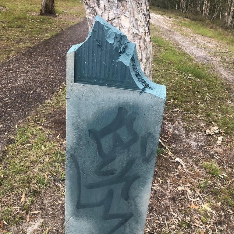 The Tin Can Bay vandals ripped off the bird information signs and other signs off their posts, while also graffitiing on other community property including a public seat. Pictures: Daryll McLaren.