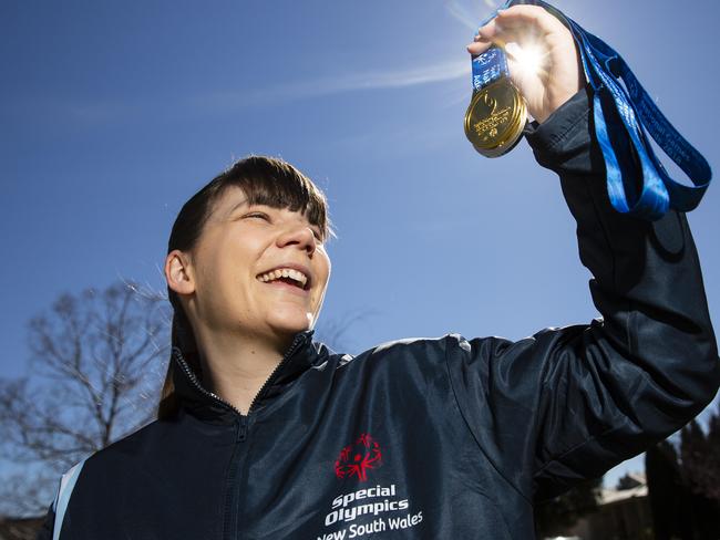 Swimmer Lauren Heggie poses for photographs near her family home in Glenwood on Friday the 11th of August 2018.Lauren Heggie has become the first Hills athlete chosen to compete at a Special Olympics World Games.(AAP Image/ Justin Sanson)