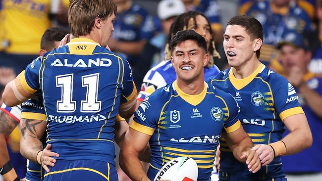 SYDNEY, AUSTRALIA - APRIL 28: Dylan Brown of the Eels celebrates with his team mates after scoring a try during the round nine NRL match between Parramatta Eels and Newcastle Knights at CommBank Stadium on April 28, 2023 in Sydney, Australia. (Photo by Mark Kolbe/Getty Images)