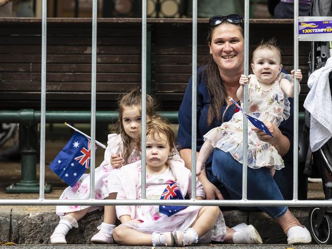 Ashlee Henderson with daughters Madison Allen, 3, Matilda Allen, 2, and Mackenzie Allen, 7 months, enjoying the ANZAC Day parade through Brisbane city. Picture: NCA NewsWire / Matthew Poon