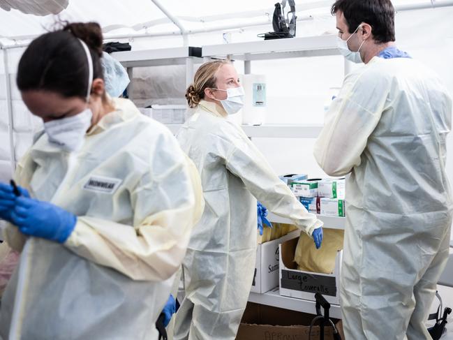 Medical workers putting on PPEs at the beginning of their shift at the emergency field hospital run by Samaritan's Purse and Mount Sinai Health System in Central Park. Picture: AFP