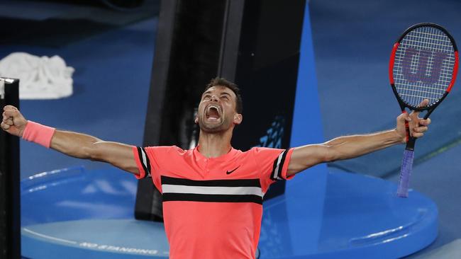 Bulgaria's Grigor Dimitrov celebrates after defeating Australia's Nick Kyrgios in his fourth round match at the Australian Open tennis championships in Melbourne, Australia Sunday, Jan. 21, 2018. (AP Photo/Ng Han Guan)