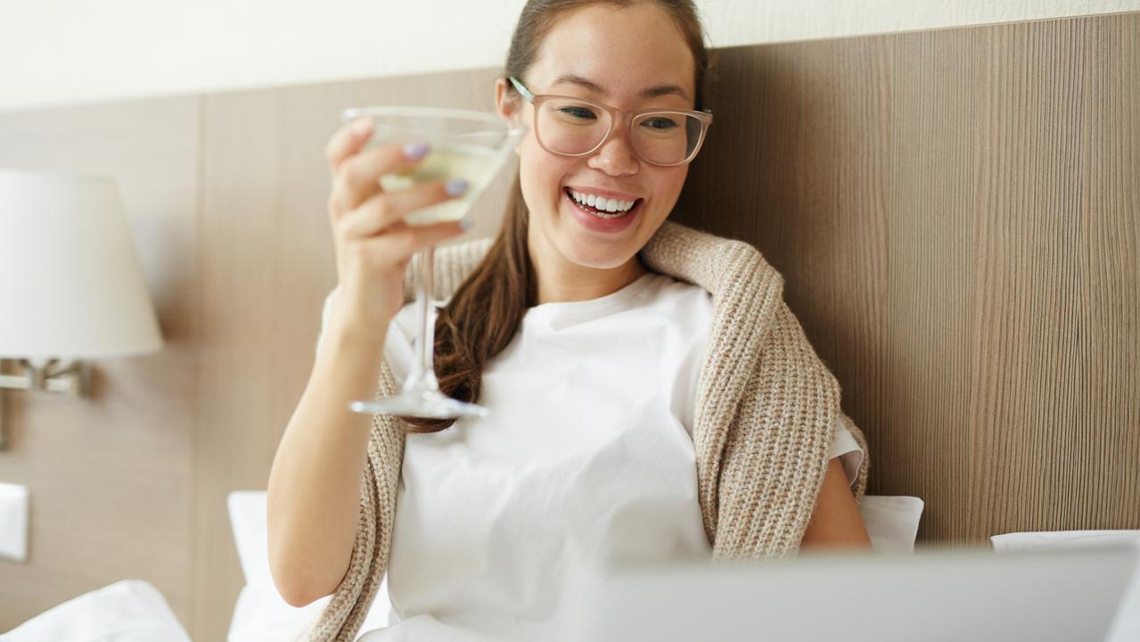 Books and bevvies in bed? Um, yes please. Picture: istock.