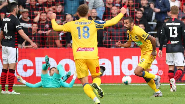 Milan Duric, right, after kicking his goal. Picture: AAP
