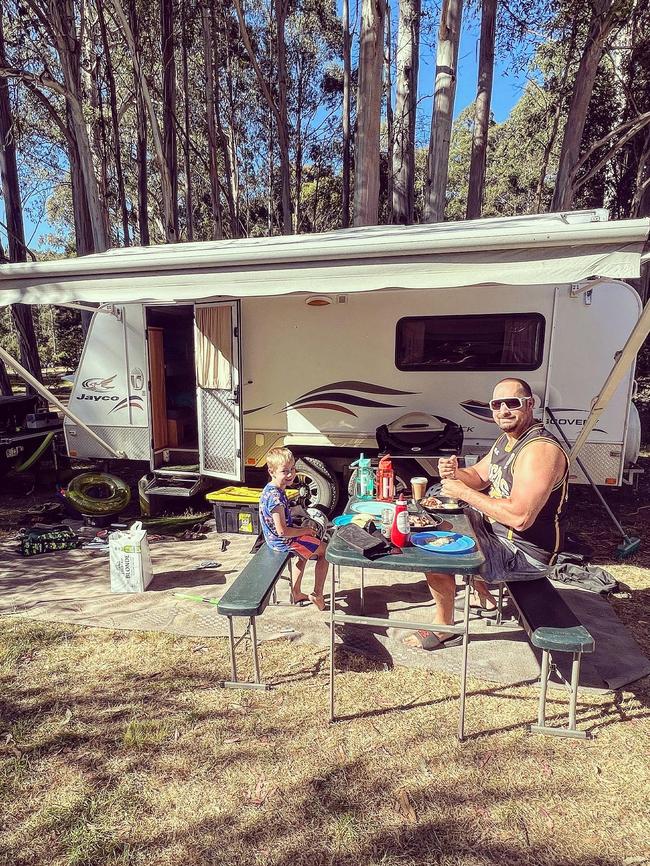 Patrick and Carl Murrell enjoy an alfresco meal while camping. Picture: Natalie Murrell @gone_caravanning_tas