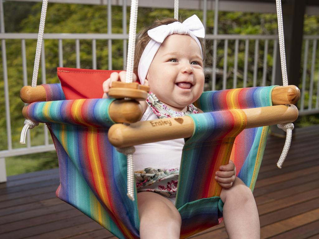 Six-month-old Ensley Damiri in a custom baby and toddler swing made in Australia by Swingz n Thingz. Photo Lachie Millard