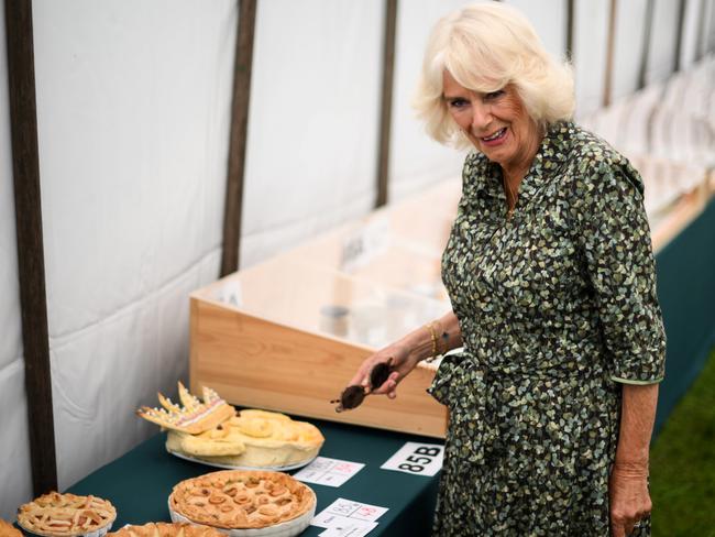 “That looks like my husband.” Queen Camiila saw the funny side of a pie made in the form of her husband. Picture: Getty Images