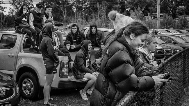 Utes as makeshift grandstands are commonplace at local footy.