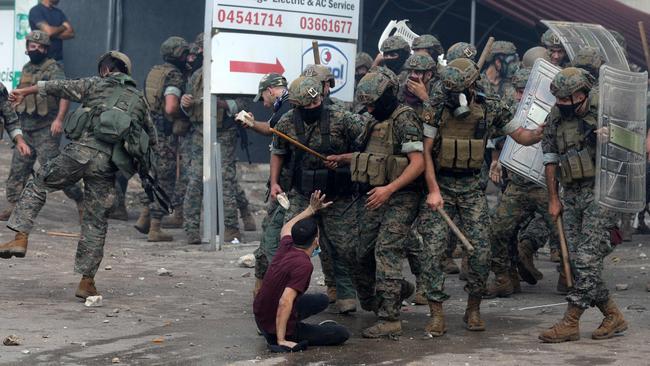 Lebanese security forces clash with protesters outside the US Embassy in Awkar east of Beirut on Wednesday. Picture: AFP