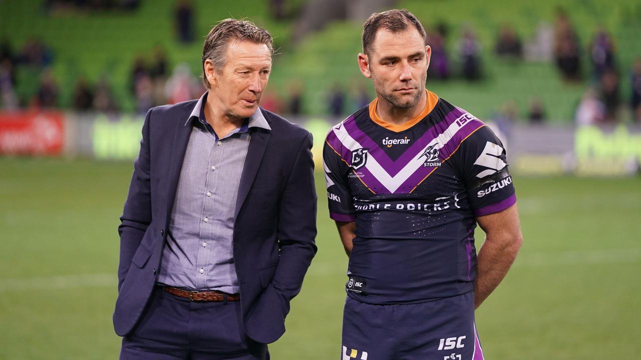 Craig Bellamy, coach of the Melbourne Storm and Cameron Smith during a celebration of his 400th game