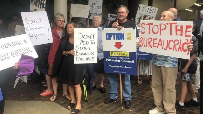 Ratepayers demonstrate outside the Northern Beaches Council meeting after a motion to pursue a hefty rate increase was passed. Picture: Jim O’Rourke