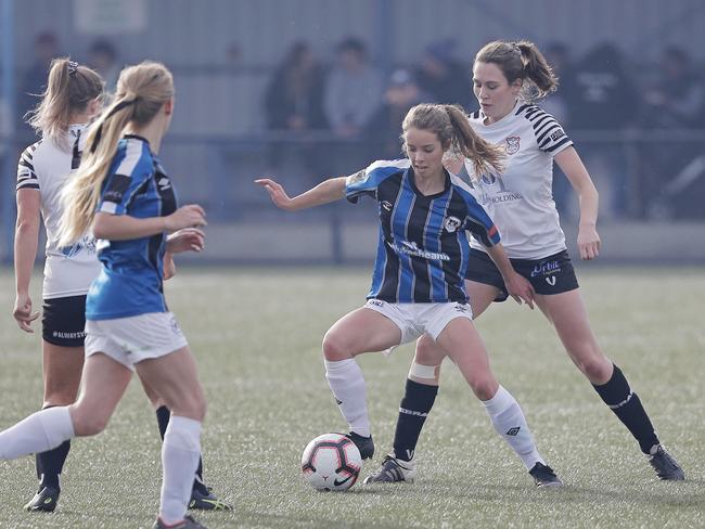 Kingborough’s Emille Tatton holds off her opponent, Hobart’s Rachel Gill. Picture: PATRICK GEE