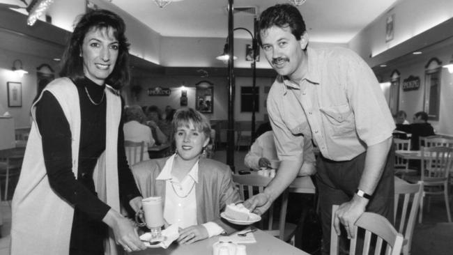 42nd Street Cafe owners Mary and Peter Rogers serving customer Sonja Hosking in 1995. Picture: Neon Martin