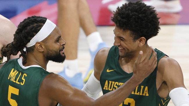 Thybulle with Boomers captain and Brooklyn Nets star Patty Mills. Picture: Ethan Miller/Getty Images/AFP