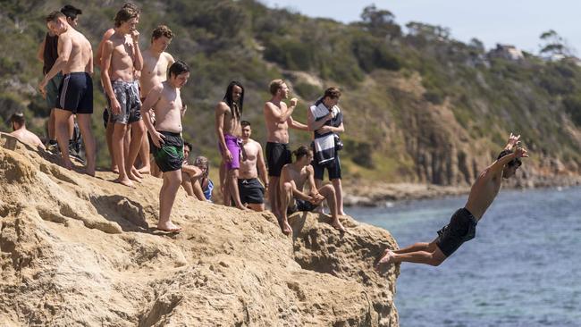 People dive off The Pillars in Mt Martha last week. Picture: Daniel Pockett